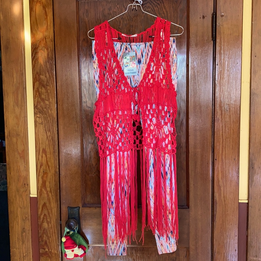 Multi colored spandex pants with crocheted vest.